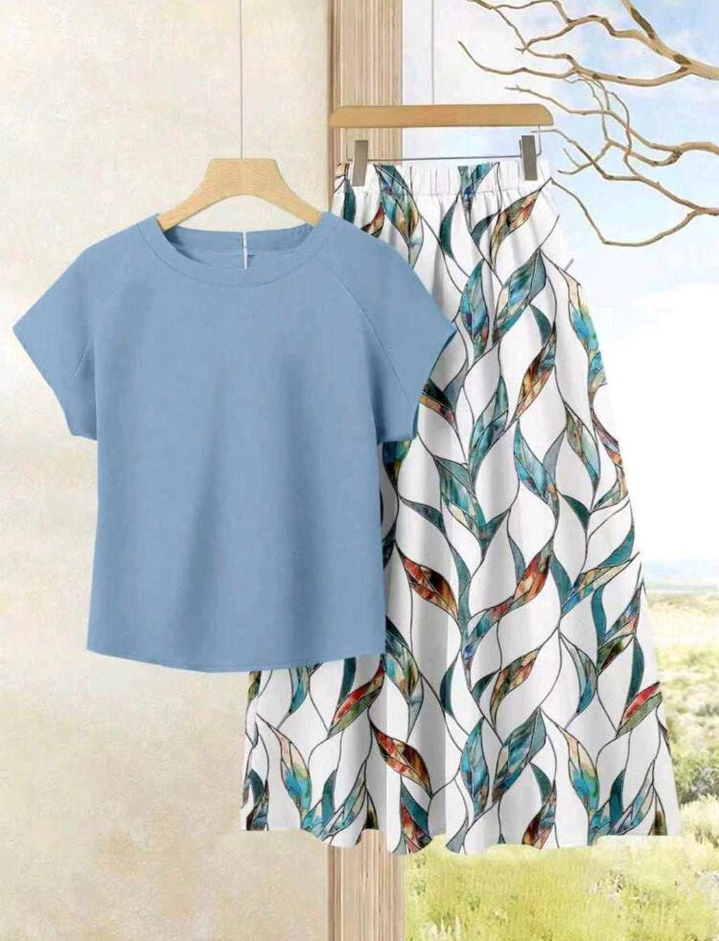 2 piezas Conjunto de falta estampada y blusa unicolor.