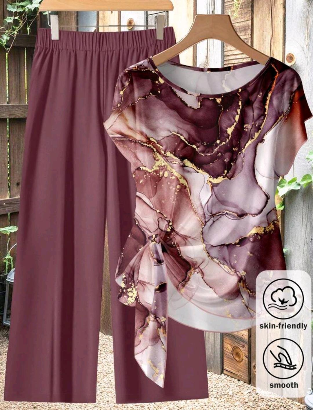 Conjunto de 2 piezas para mujer talla grande, estilo casual de vacaciones, top holgado de manga corta tipo murciélago con estampado de mármol y pantalón largos de pierna ancha.