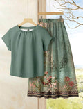 Rusticease Conjunto de 2 piezas de talla grande con blusa unicolor casual y falda con estampado floral.