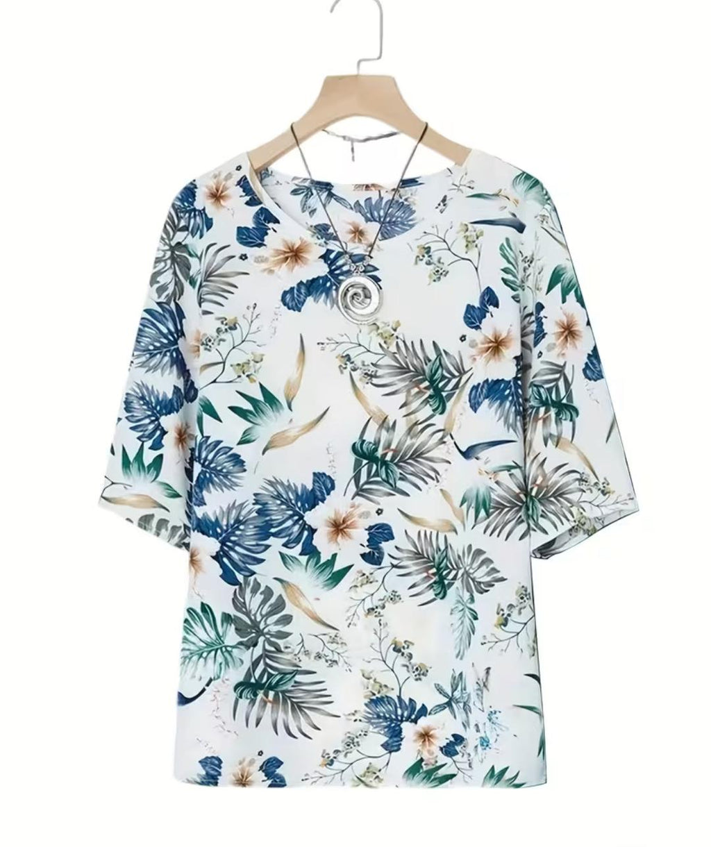 Conjunto de 2 piezas de pantalón y blusa con estampado floral.