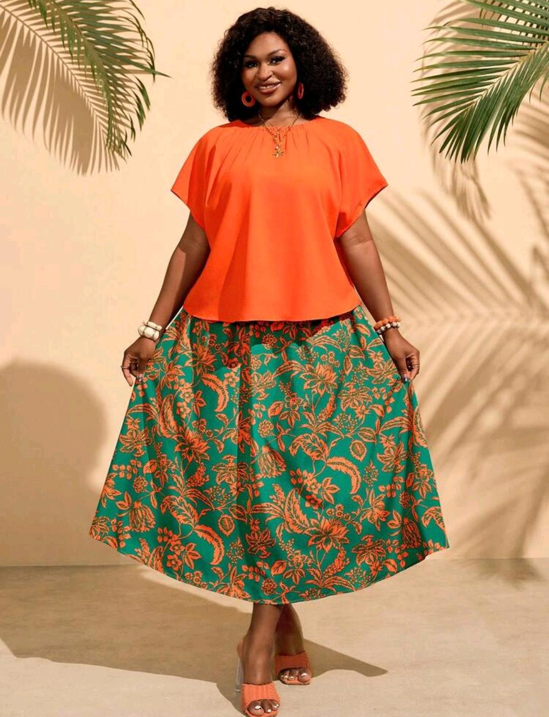 Conjunto de 2 piezas para mujer talla grande: top de manga corta con cuello redondo de color liso y falda con estampado integral, para verano, playa y oficina, en naranja quemado y verde esmeralda
