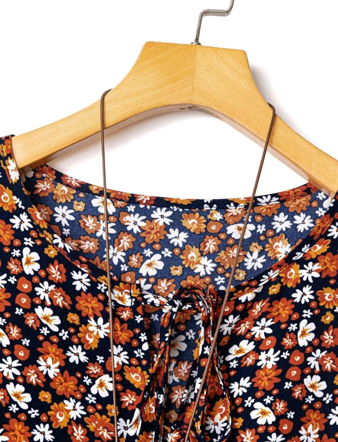 Conjunto de camisa casual con nudo delantero con estampado floral pequeño y pantalón de pierna ancha de un solo color para mujer de talla grande