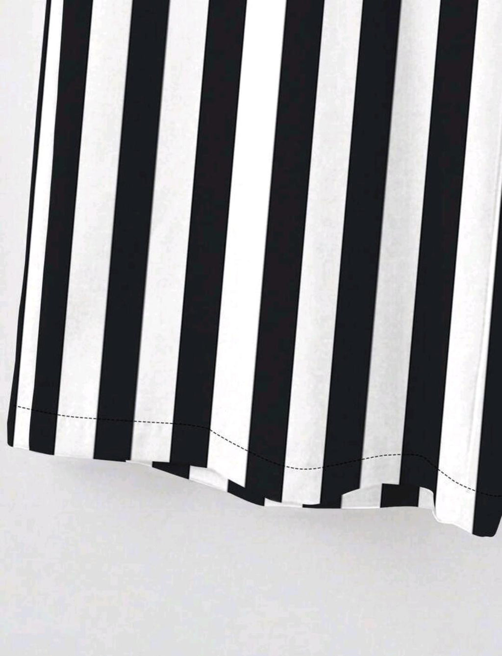 Conjunto casual de dos piezas incluye una blusa de talla grande de unicolor con cuello en V manga larga, y pantalones de pierna ancha estampados a rayas en blanco y negro.