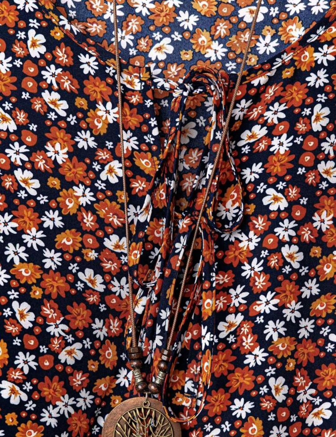 Conjunto de camisa casual con nudo delantero con estampado floral pequeño y pantalón de pierna ancha de un solo color para mujer de talla grande