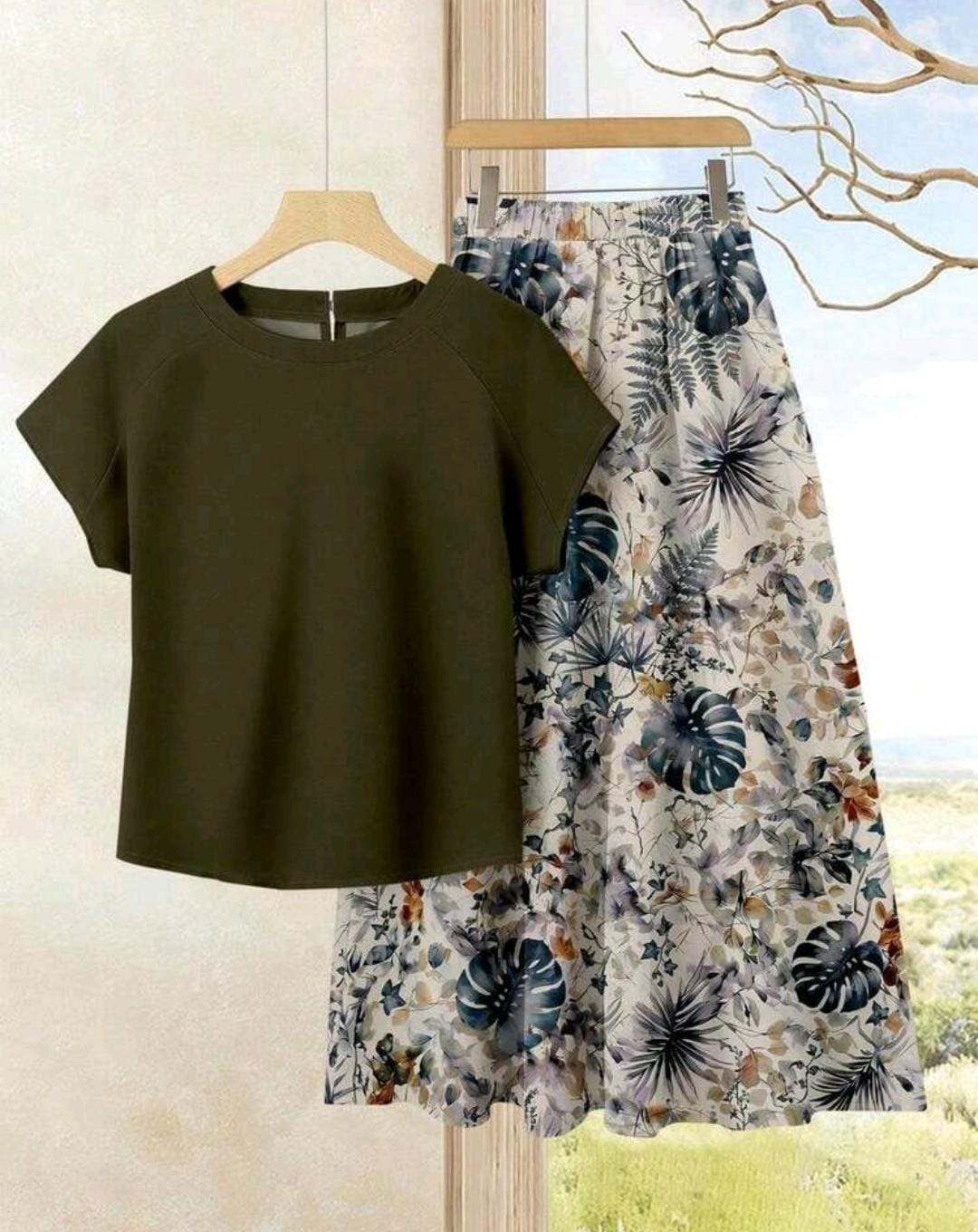 Conjunto de 2 piezas de falda con estampado floral y blusa unicolor.